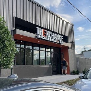 Exterior entrance of The Exchange Pickleball + Bar + Restaurant