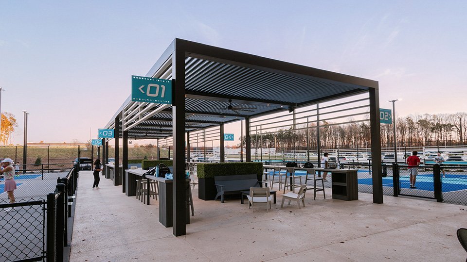 Outdoor pickleball courts at The Serve Pickleball + Kitchen in Cornelius, NC